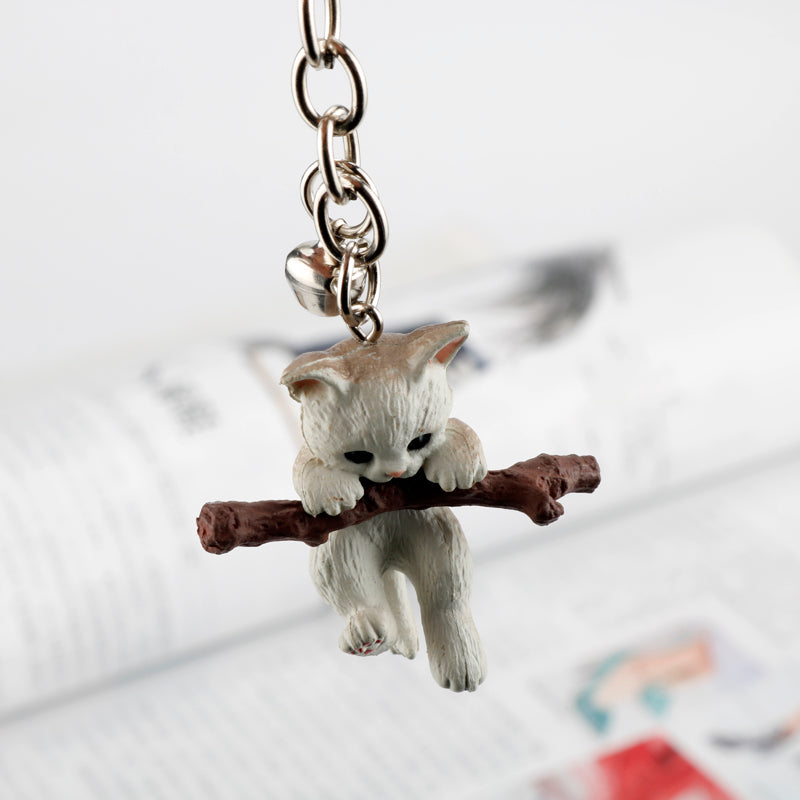 Keychain for holding tree branch cat doll