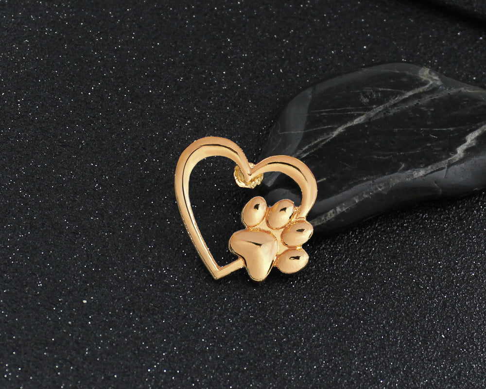 Caring dog paw cutout brooch