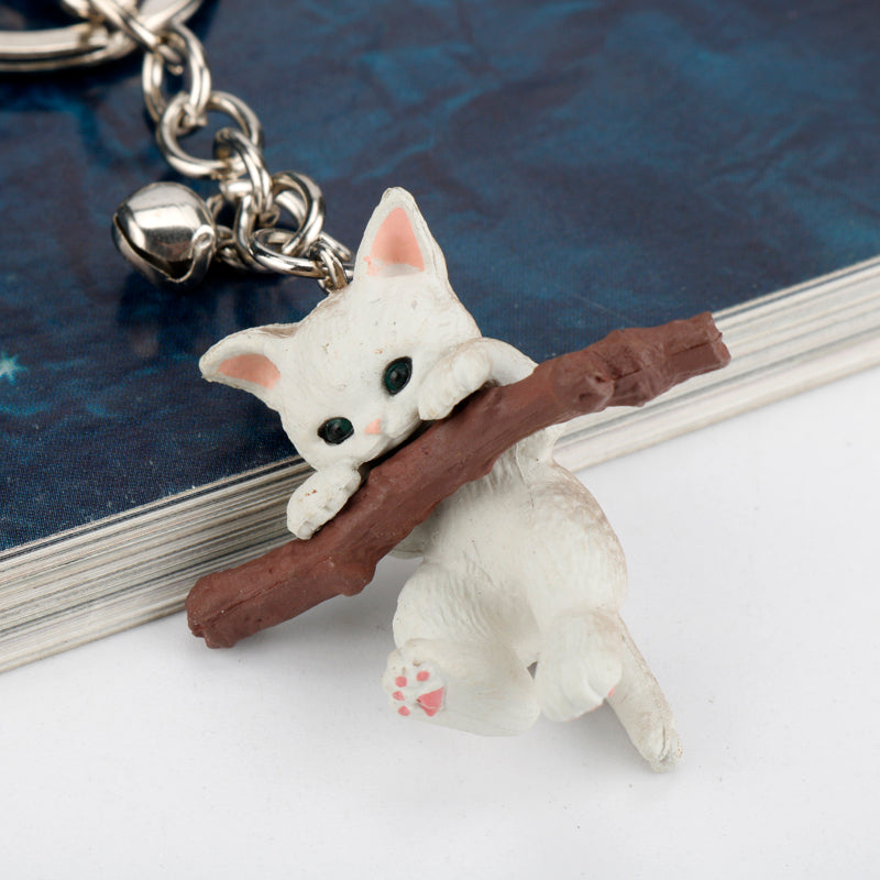 Keychain for holding tree branch cat doll