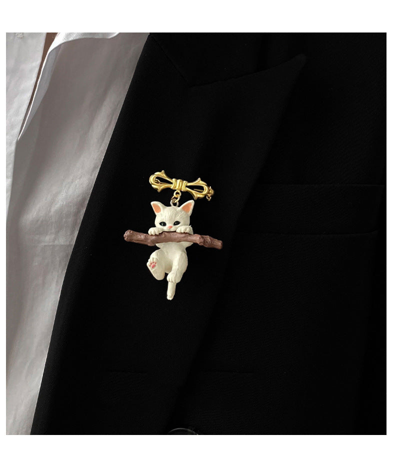 Adorable Kitten Brooch Holding Branches